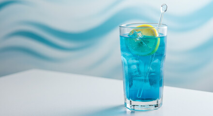 Vibrant blue ocean cocktail with ice cubes and lemon slice refreshing tropical drink served on a table by beachside bar