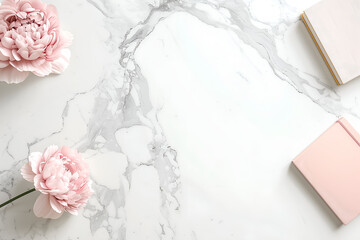 Flatlay pink flowers and notebooks on marble backgournd