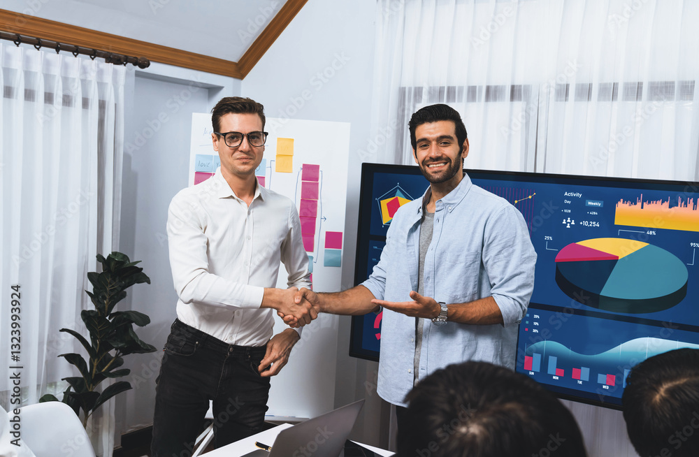 Leinwandbilder Analyst team leader shake hand with his colleague after successful data analysis meeting using FIntech software power with business intelligence or BI dashboard. Prudent
