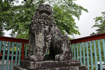 sculpted lion in a shinto temple sendai in japan