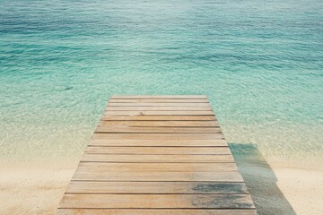 Fototapeta premium Tranquil wooden pier extending into turquoise water. A serene beach scene