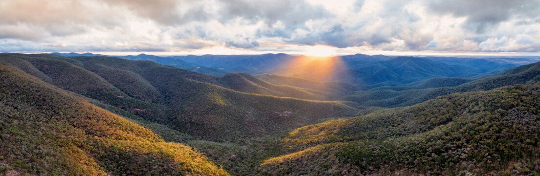 Clouds and sunrise over valleys and mountains