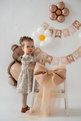 baby's birthday, baby girl celebrates birthday on holiday photo zone