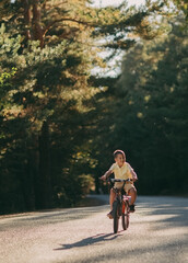 A boy rides a bike in the park