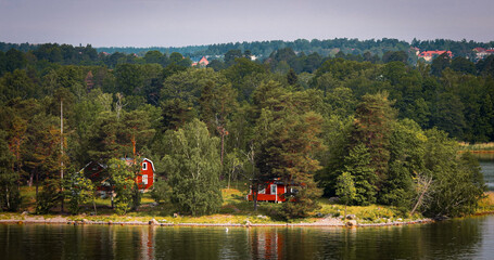 Panoramic View On Many Red Swedish Wooden Sauna Logs Cabins Hous