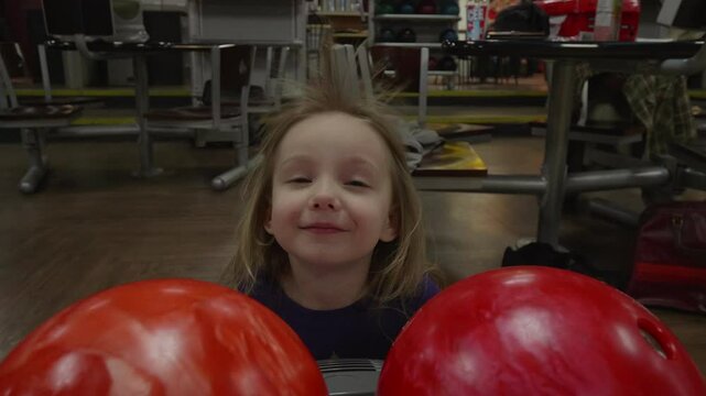Little Girls Hair Blowing with the Bowling Alley Fan