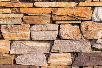 Obraz premium Architectural decoration. Wall made of colored stones