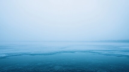 Misty Winter Lake: A Serene Frozen Landscape