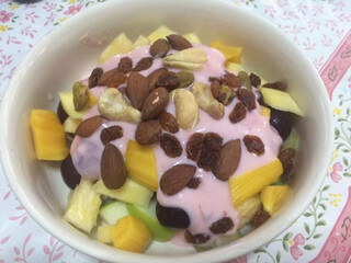 Ingredient of mixed cutting fruit for cook fruit salad with almond in dish,  fresh healthy breakfast on vintage table