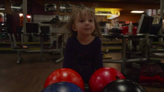 Little Girls Hair Blowing at the Bowling Alley