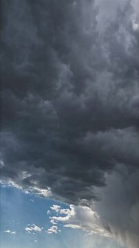 time-lapse video capturing dark storm clouds rolling rapidly across the sky,