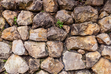 A courtyard wall made of piled stones