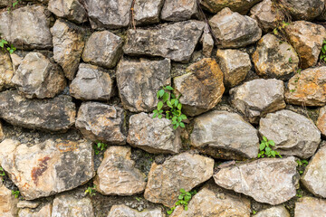 A courtyard wall made of piled stones