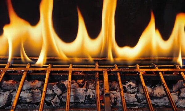 A vivid flame dances across the grill, set against a dark backdrop. Captured in slow motion at 1000 frames per second, this high-quality Full HD footage showcases the mesmerizing fire
