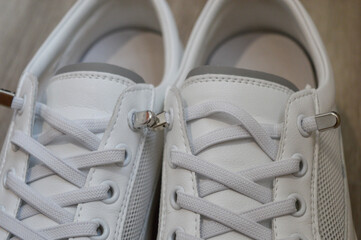 white sneaker with an elegant design high-quality stitching footwear shoe stores detail fashion lifestyle styling tips minimalist athleisure casual wear eco-friendly materials sportswear sustainable 