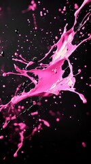 Vibrant pink paint splash against a dark background, creating dynamic motion