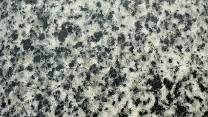 Texture of polished granite with black inclusions