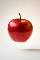 Fresh Red Apple Floating on White