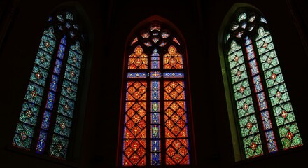 Stained glass windows in a cathedral. Religious, architectural design perfect for faith, church, or historical themes