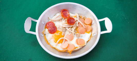 pan-fried egg with pork and toppings. Breakfast food in Thai style