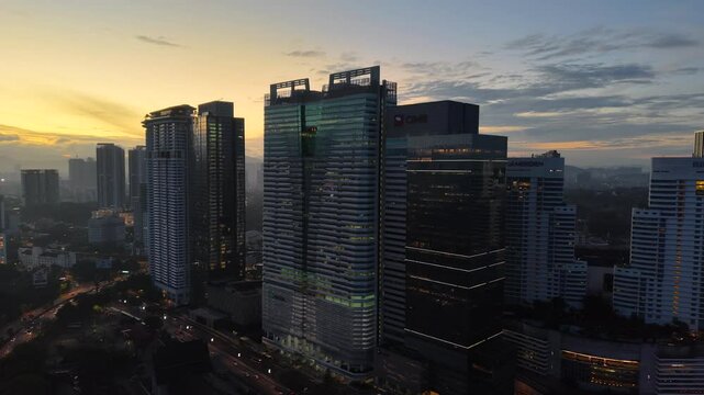 kuala lumpur morning scenery 2025 dramatic sunrise and busy street with cars