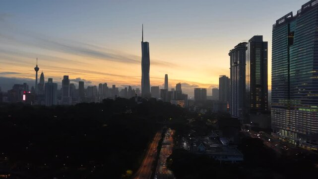 kuala lumpur morning scenery 2025 dramatic sunrise and busy street with cars