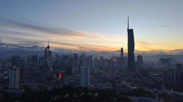 kuala lumpur morning scenery 2025 dramatic sunrise and busy street with cars