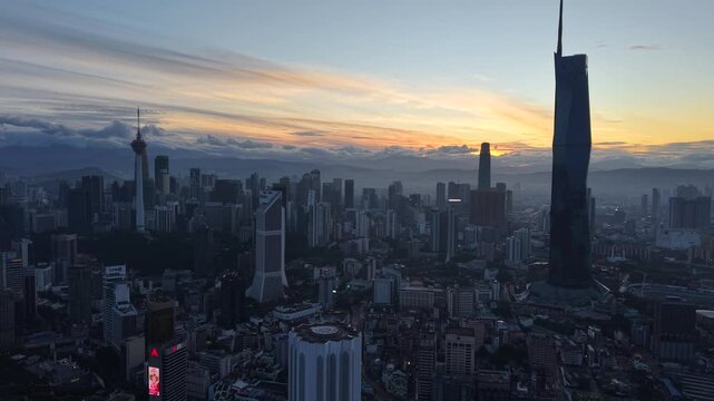 kuala lumpur morning scenery 2025 dramatic sunrise and busy street with cars