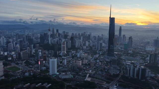 kuala lumpur morning scenery 2025 dramatic sunrise and busy street with cars