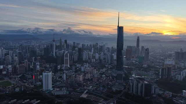 kuala lumpur morning scenery 2025 dramatic sunrise and busy street with cars