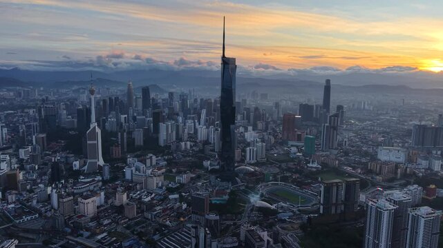kuala lumpur morning scenery 2025 dramatic sunrise and busy street with cars