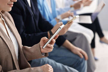 Group of people using different gadgets indoors, closeup. Modern technology