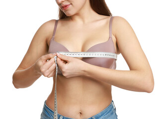 Woman in beautiful bra measuring breast circumference on white background, closeup