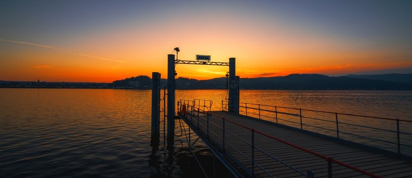 Sunset landscape on the pier of Angera Italy.