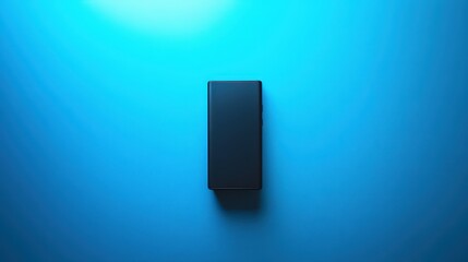 A sleek, black handheld gadget, its form a testament to minimalist design, rests against a vibrant blue backdrop, bathed in soft, ambient light.