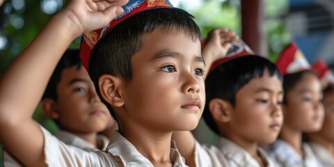 Asian children wearing traditional hats participate in cultural ceremony