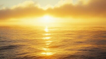 Fototapeta premium Golden Sunrise Over Misty Sea