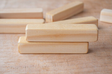 Wooden blocks on wooden table with customizable space for text. Copy space concept.