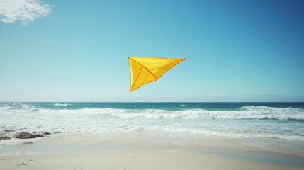 Yellow kite flying over beach