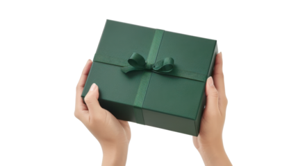 Woman holding a green gift box with a ribbon on a transparent background