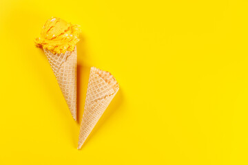 A refreshing ice cream cones set against a vibrant yellow background