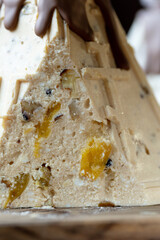 Beautiful and delicious cottage cheese Easter cake with walnuts and candles on a wooden background