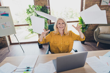 Photo of impressed angry lady specialist dressed shirt working modern device throwing papers...