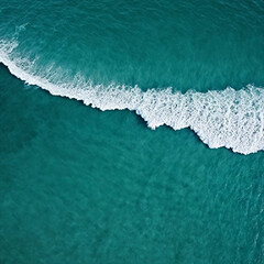 Aerial view beautiful of sea waves from drone. Stock image of blue color of ocean water, sea surface. Top view on turquoise waves, clear water surface texture.