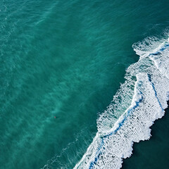 Fototapeta premium Aerial view beautiful of sea waves from drone. Stock image of blue color of ocean water, sea surface. Top view on turquoise waves, clear water surface texture.