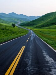 Fototapeta premium Driving on Scenic Route Through Green Hills and Distant Mountains