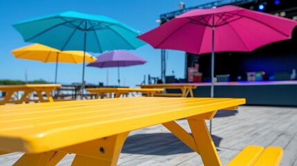 Fototapeta premium Colorful Outdoor Seating with Umbrellas at Summer Event Venue