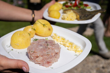 Fish dish - whitefish tartar with boiled potatoes and butter. Whitefish tartar with potato and butter. 