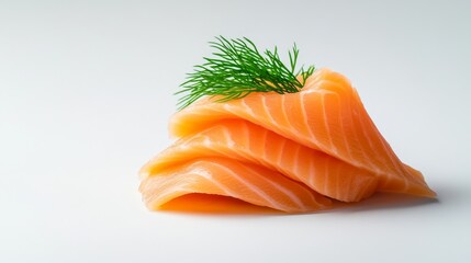 Fresh salmon sashimi with dill garnish on a clean background