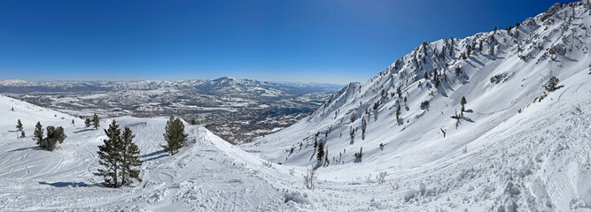 Panoramic view of the snowy mountains at Snowbasin ski resort.